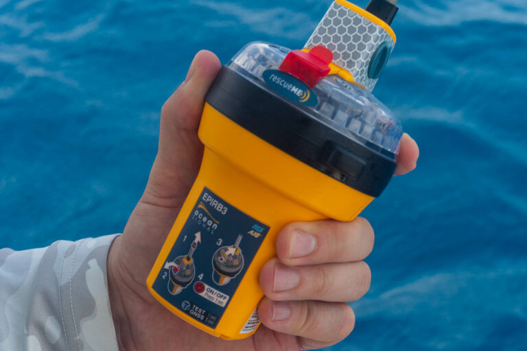The New Ocean Signal rescueME EPIRB3 with AIS Emergency Position Indicating Radio Beacon held in hand up close