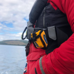 PLB1 with floatation pouch fitted, clipped to a inflatable lifejacket